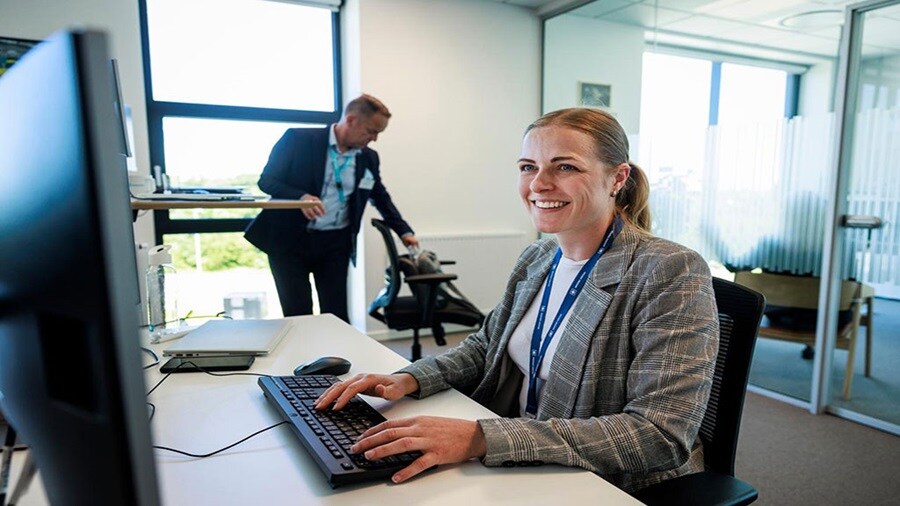 Woman sitting at a computer working on customs declarations