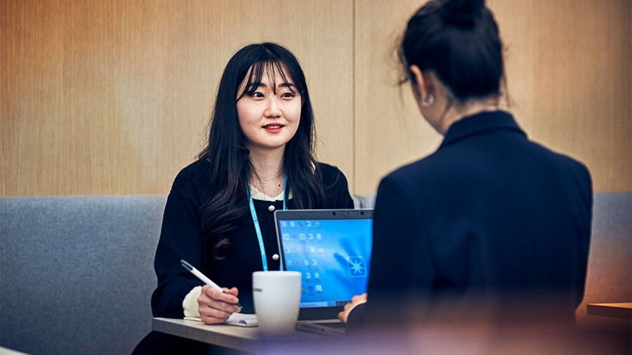 Office workers having a meeting and coffee