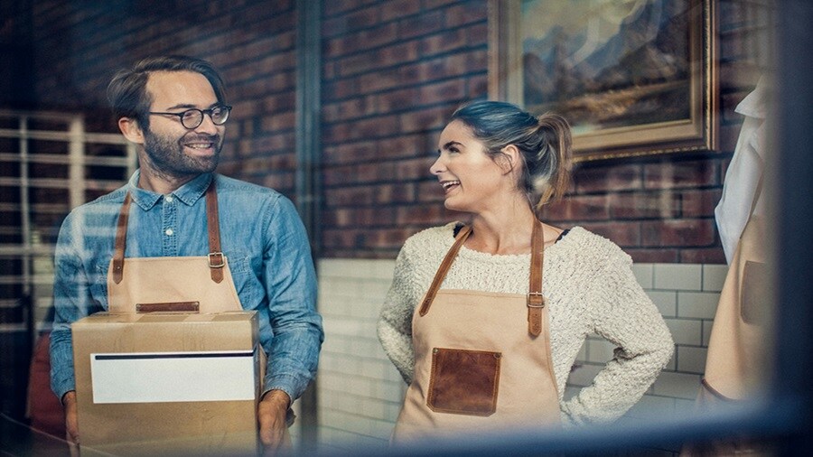 Small business owners preparing parcels for ecommerce shipment