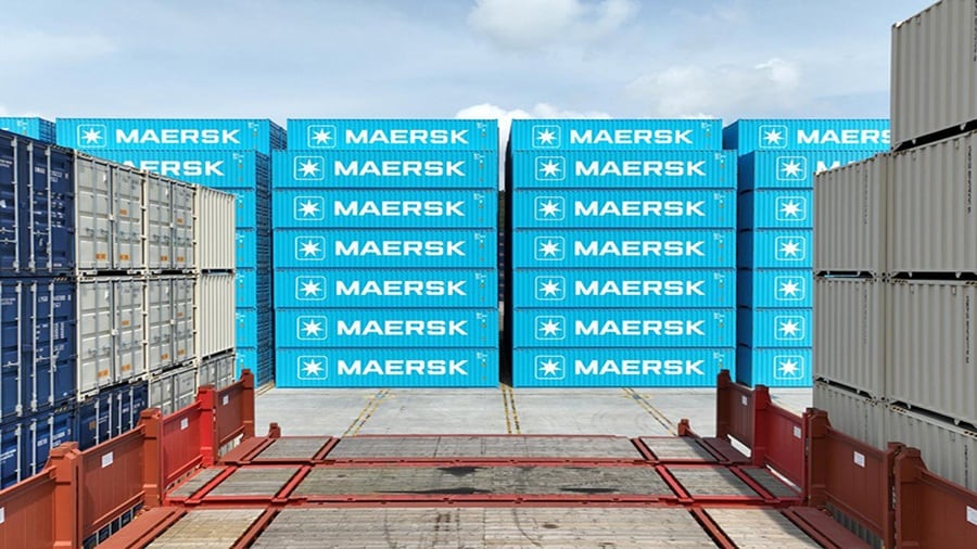 A stack of Maersk blue containers at a container depot