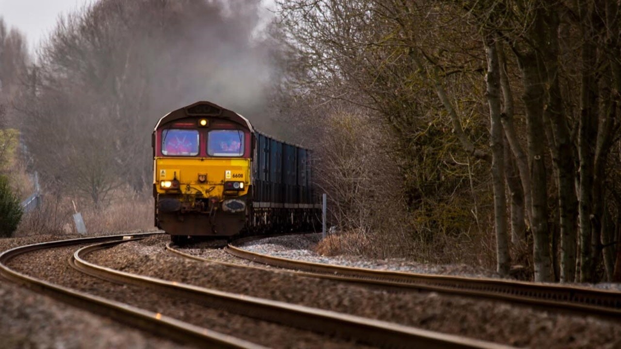 Freight train moving on curved tracks