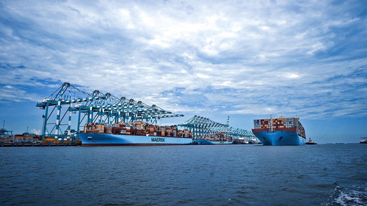 Maersk vessels on the water and at the port.