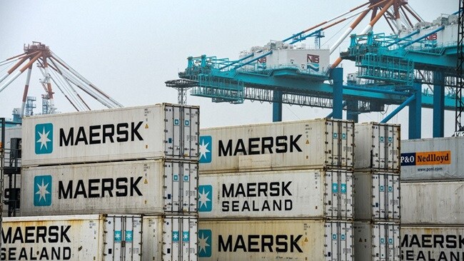 Stacked Maersk reefer containers at port.
