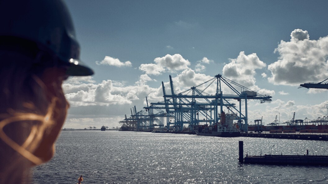 An employee looking into the distance at a Maersk port