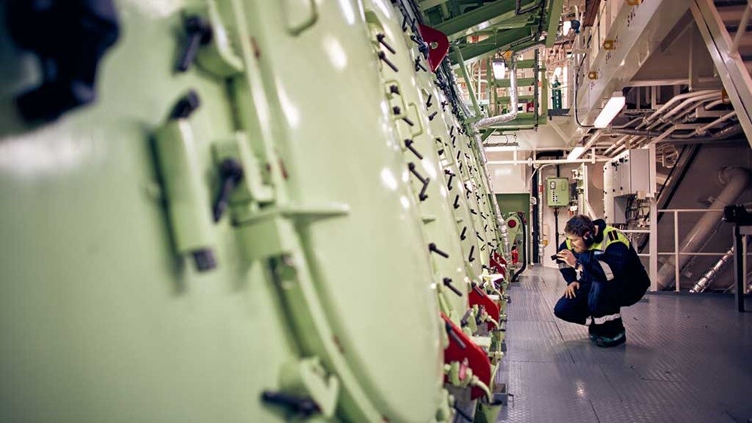 A person looking at machinery