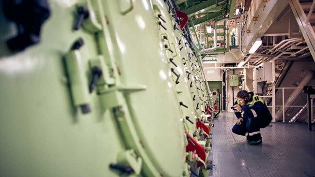 A person looking at machinery